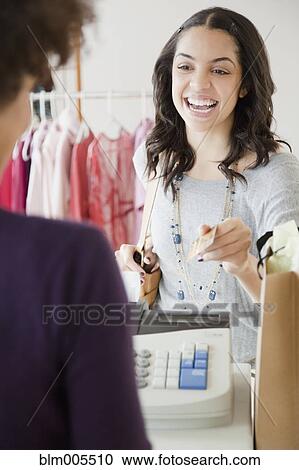 Customer handing sales clerk credit card View Large Photo Image Stock Image - Customer handing sales clerk credit card. Fotosearch
