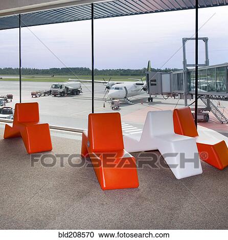 Departure lounge waiting area with modern plastic colored seats View Large Photo Image Stock Image - Departure lounge waiting area with modern plastic colored seats. Fotosearch