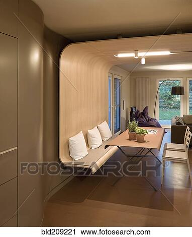 Stock Image - Dining table and chairs in modern home. Fotosearch