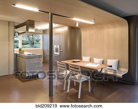Stock Photo - Dining table and chairs in modern home. Fotosearch