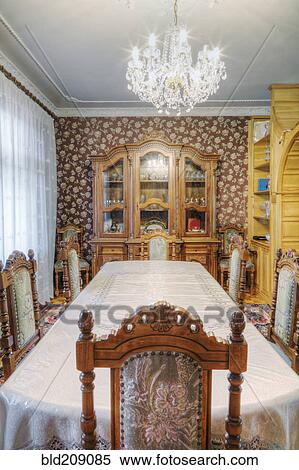 Stock Photography - Dining table and hutch in dining room. Fotosearch