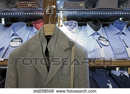 Stock Photo - Display of men's shirts and a jacket. Fotosearch