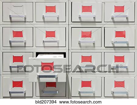 Drawers and red labels in an antique archive cabinet View Large Photo Image Picture - Drawers and red labels in an antique archive cabinet. Fotosearch