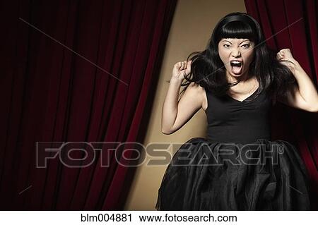 Stock Image - Elegant Chinese woman screaming. Fotosearch