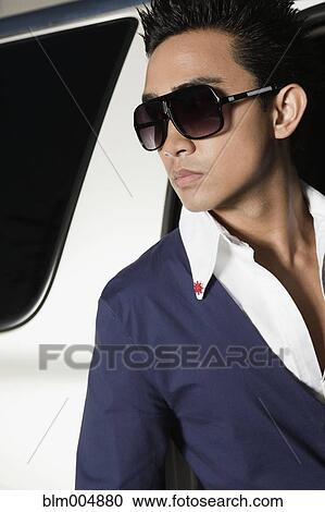 Elegant man getting out of car View Large Photo Image Stock Image - Elegant man getting out of car. Fotosearch