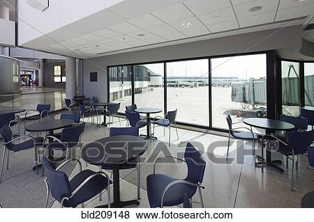 Empty cafe overlooking runway in airport View Large Photo Image Stock Photo - Empty cafe overlooking runway in airport. Fotosearch