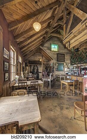 Stock Image - Empty chairs and tables in restaurant. Fotosearch