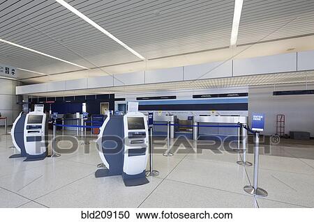 Stock Image - Empty check-in area in airport. Fotosearch