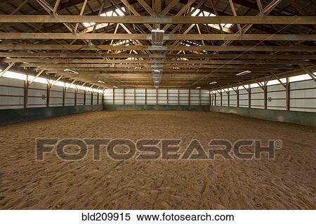 Stock Photography - Empty indoor horse riding ring. Fotosearch