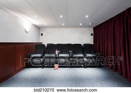Stock Image - Empty seats in home theater. Fotosearch