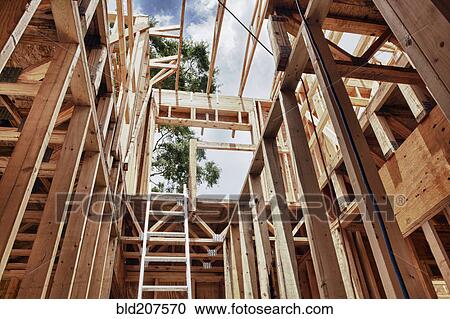 Stock Image - Extension Ladder and Framing. Fotosearch
