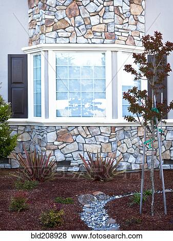 Exterior wall of a house with stone cladding View Large Photo Image Stock Photo - Exterior wall of a house with stone cladding. Fotosearch