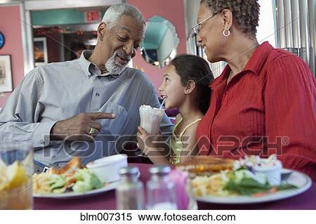 Family in restaurant View Large Photo Image Stock Photography - Family in restaurant. Fotosearch