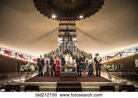 Family posing at wedding in church View Large Photo Image Stock Image - Family posing at wedding in church. Fotosearch