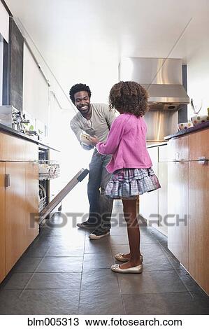 Father and daughter loading dishwasher View Large Photo Image Stock Image - Father and daughter loading dishwasher. Fotosearch