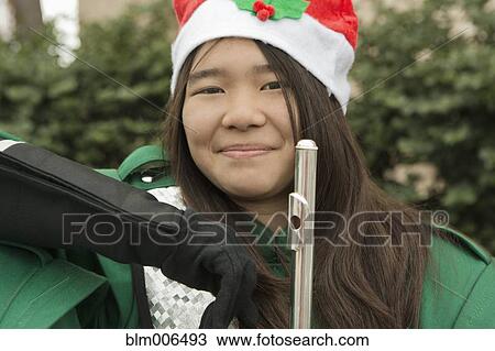 Flute player in marching band wearing santa hat View Large Photo Image Stock Image - Flute player in marching band wearing santa hat. Fotosearch
