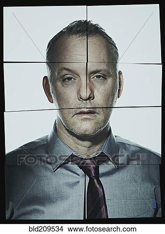 Picture - Fractured pieces of Caucasian businessman. Fotosearch