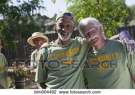 Friends doing community yardwork View Large Photo Image Stock Image - Friends doing community yardwork. Fotosearch