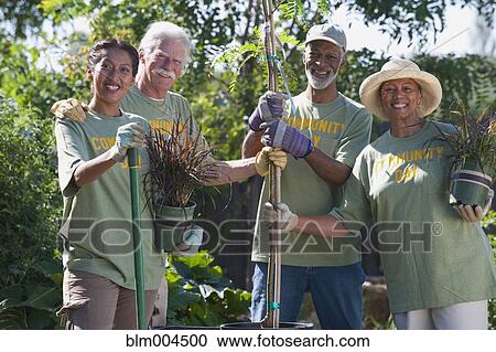 Friends doing community yardwork View Large Photo Image Stock Image - Friends doing community yardwork. Fotosearch