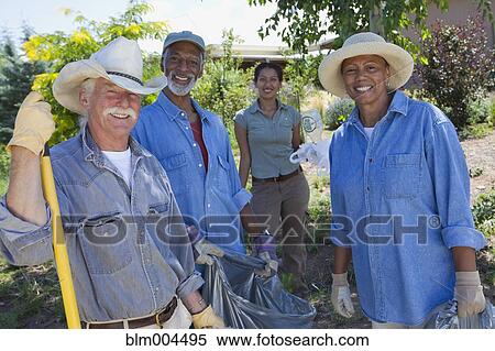 Friends doing community yardwork View Large Photo Image Stock Photography - Friends doing community yardwork. Fotosearch