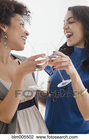 Friends drinking white wine View Large Photo Image Stock Image - Friends drinking white wine. Fotosearch