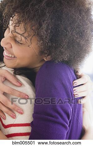 Friends hugging View Large Photo Image Stock Image - Friends hugging. Fotosearch