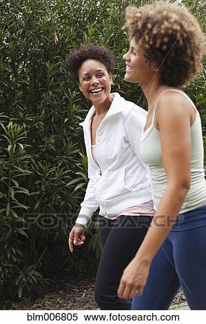 Stock Photography - Friends walking outdoors. Fotosearch