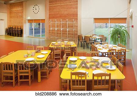 Furniture, tables and chairs laid for a meal View Large Photo Image Stock Photograph - Furniture, tables and chairs laid for a meal. Fotosearch
