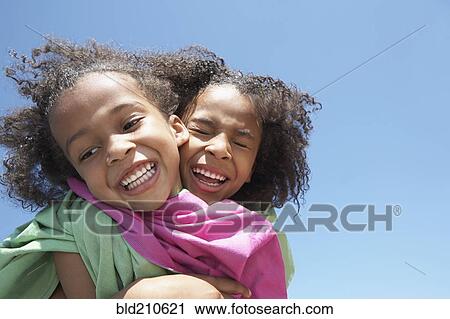 Girls playing together outdoors View Large Photo Image Stock Image - Girls playing together outdoors. Fotosearch