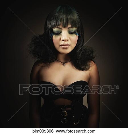 Glamorous Asian woman with extreme makeup View Large Photo Image Stock Photograph - Glamorous Asian woman with extreme makeup. Fotosearch