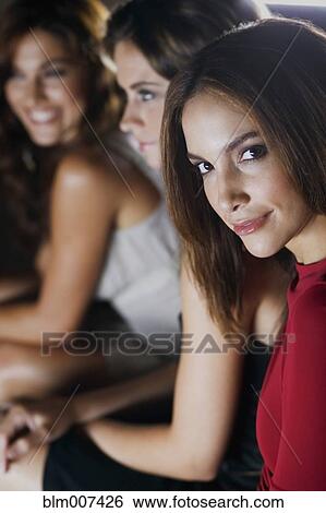 Glamorous women in nightclub View Large Photo Image Stock Photograph - Glamorous women in nightclub. Fotosearch