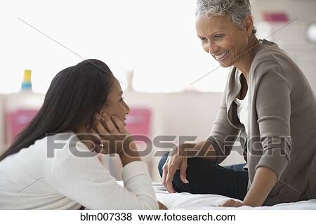 Stock Photo - Grandmother and granddaughter relaxing. Fotosearch