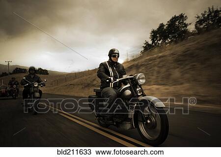 Group riding motorcycles on rural road View Large Photo Image Stock Image - Group riding motorcycles on rural road. Fotosearch