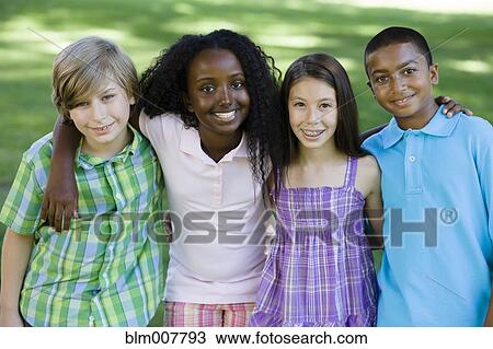 Stock Image - Happy children hugging. Fotosearch