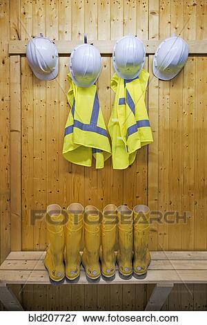 Stock Photo - Hard hats and safety vests with reflective stripes. Fotosearch