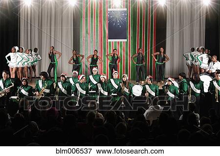 High school dance team and marching band performing on stage View Large Photo Image Stock Photo - High school dance team and marching band performing on stage. Fotosearch