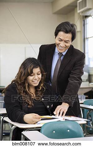 High school student listening to teacher View Large Photo Image Stock Photo - High school student listening to teacher. Fotosearch