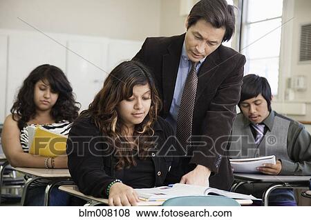High school student listening to teacher View Large Photo Image Stock Photo - High school student listening to teacher. Fotosearch