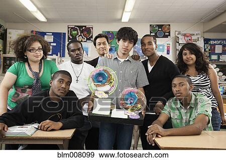 Stock Photo - High school students and teacher in science classroom. Fotosearch