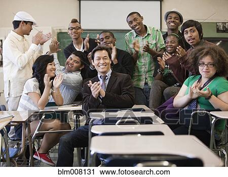 High school students and teacher clapping in classroom View Large Photo Image Stock Image - High school students and teacher clapping in classroom. Fotosearch