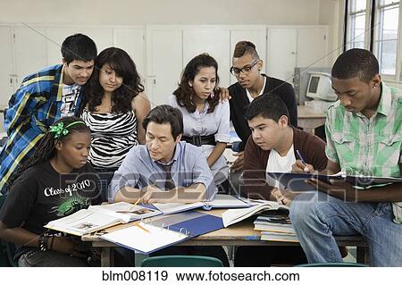 Stock Photo - High school students listening to teacher. Fotosearch