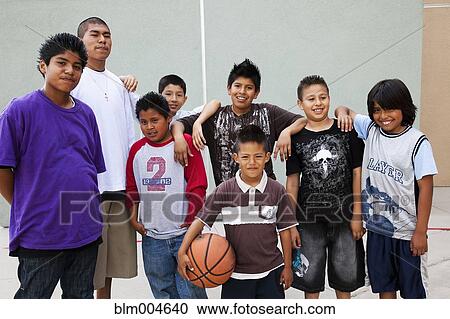 Hispanic boys posing with basketball View Large Photo Image Stock Image - Hispanic boys posing with basketball. Fotosearch
