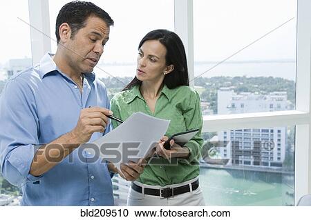 Hispanic business people talking in office View Large Photo Image Stock Image - Hispanic business people talking in office. Fotosearch