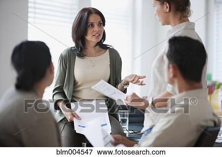 Stock Photo - Hispanic business people working together. Fotosearch