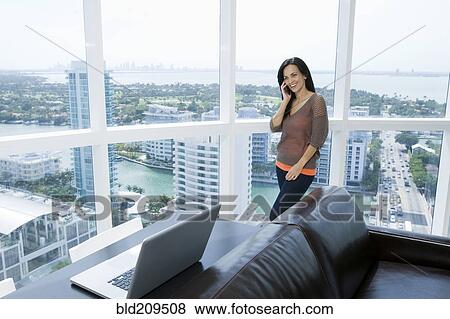 Hispanic businesswoman talking on cell phone View Large Photo Image Stock Photo - Hispanic businesswoman talking on cell phone. Fotosearch