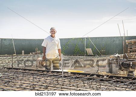 Hispanic construction worker at construction site View Large Photo Image Stock Photo - Hispanic construction worker at construction site. Fotosearch