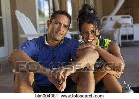Hispanic couple in sportswear sitting on porch View Large Photo Image Stock Image - Hispanic couple in sportswear sitting on porch. Fotosearch