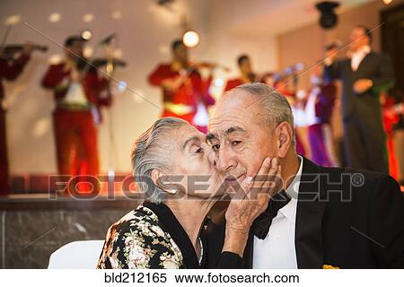 Hispanic couple kissing at wedding reception View Large Photo Image Stock Photography - Hispanic couple kissing at wedding reception. Fotosearch