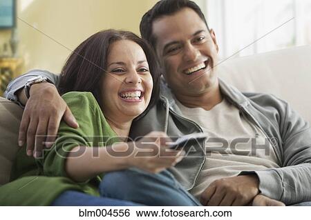Stock Photograph - Hispanic couple watching television. Fotosearch