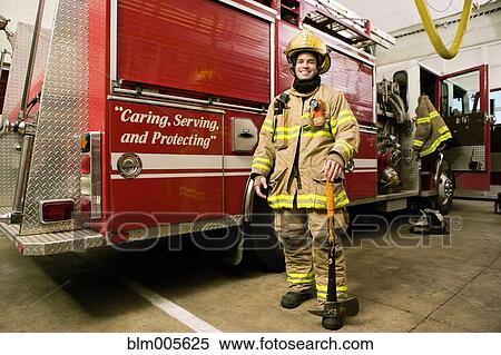 Hispanic fireman in coat and helmet View Large Photo Image Stock Photography - Hispanic fireman in coat and helmet. Fotosearch